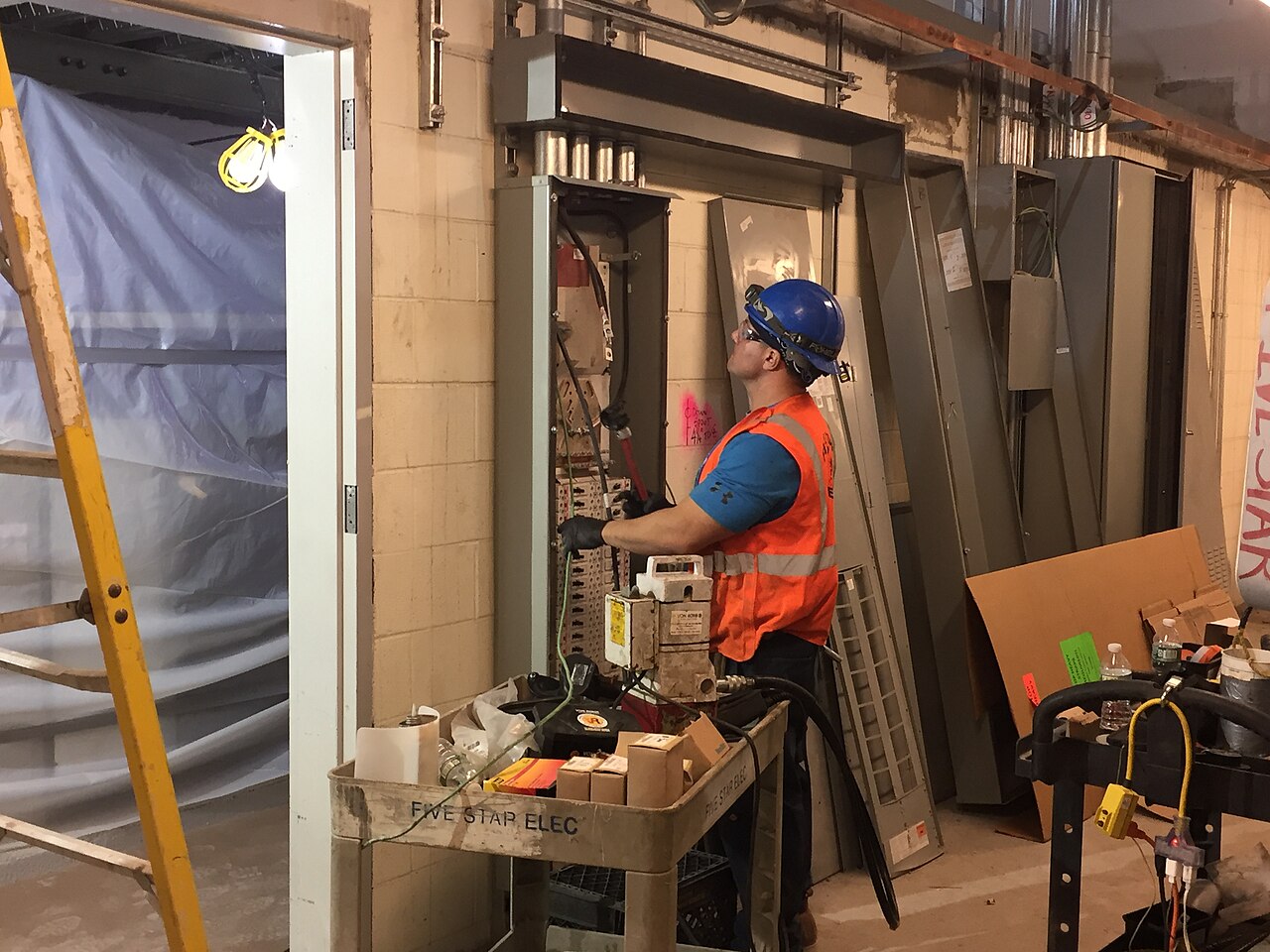 Electrician working on a commercial electrical installation